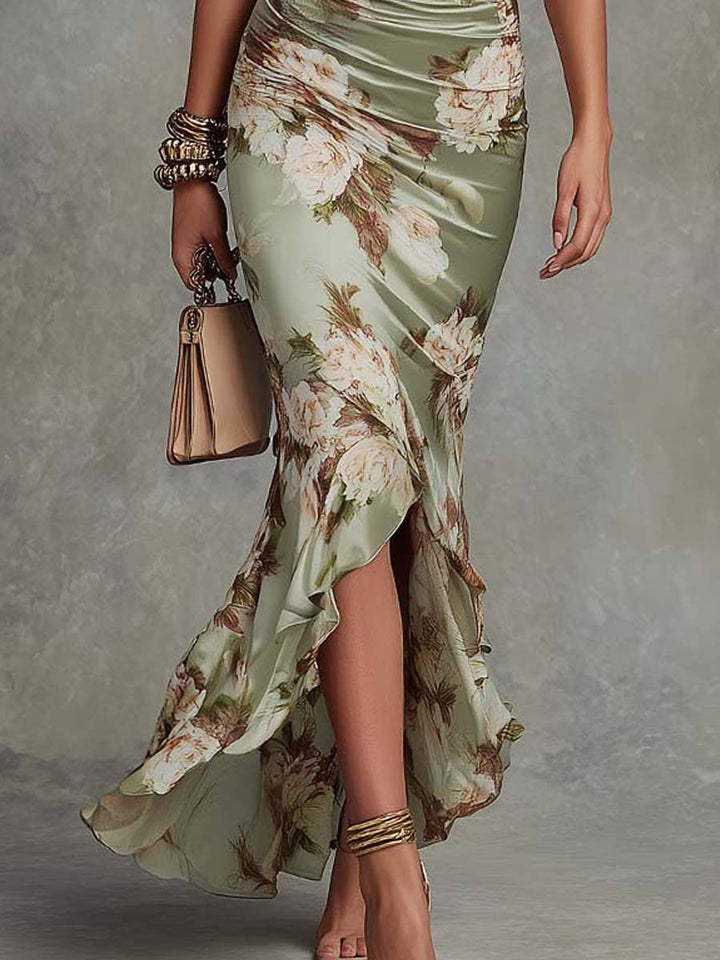 Anne | Long asymmetrical satin dress in green with V-neck, puff sleeves, and floral print