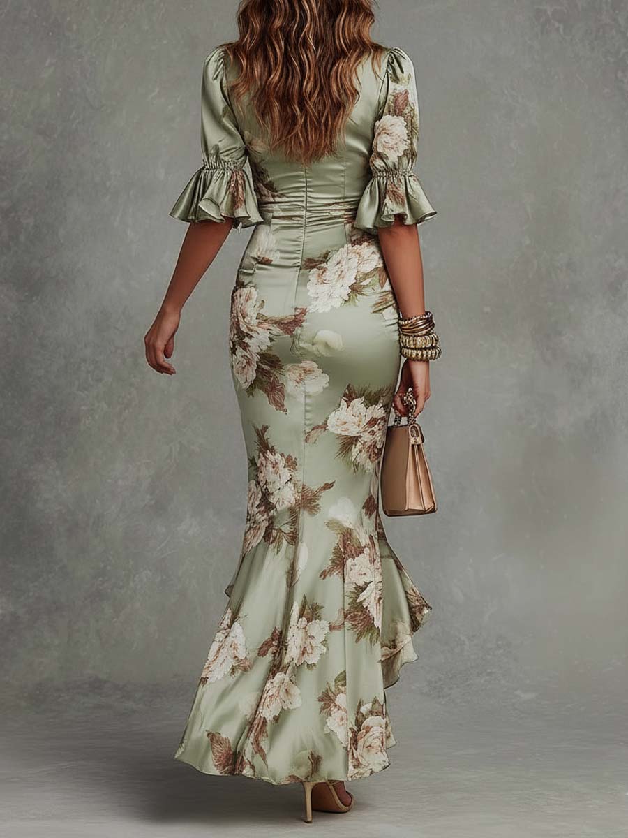 Anne | Long asymmetrical satin dress in green with V-neck, puff sleeves, and floral print