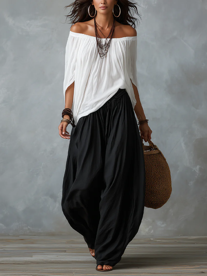 White off-shoulder top and flared lantern-style pants