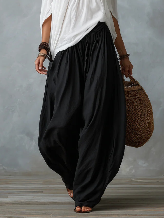 White off-shoulder top and flared lantern-style pants