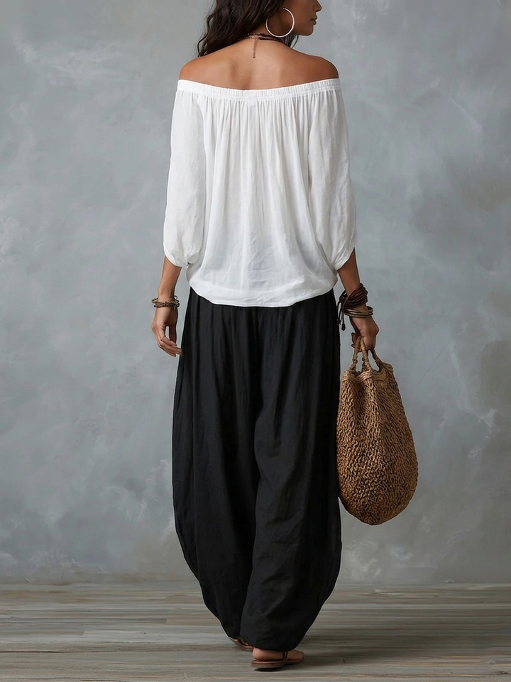 White off-shoulder top and flared lantern-style pants